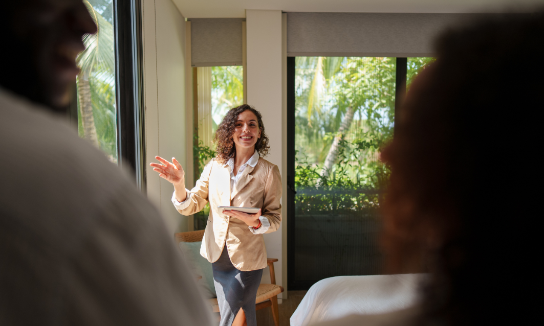 An estate agent welcoming prospective buyers during a property viewing in south Birmingham.