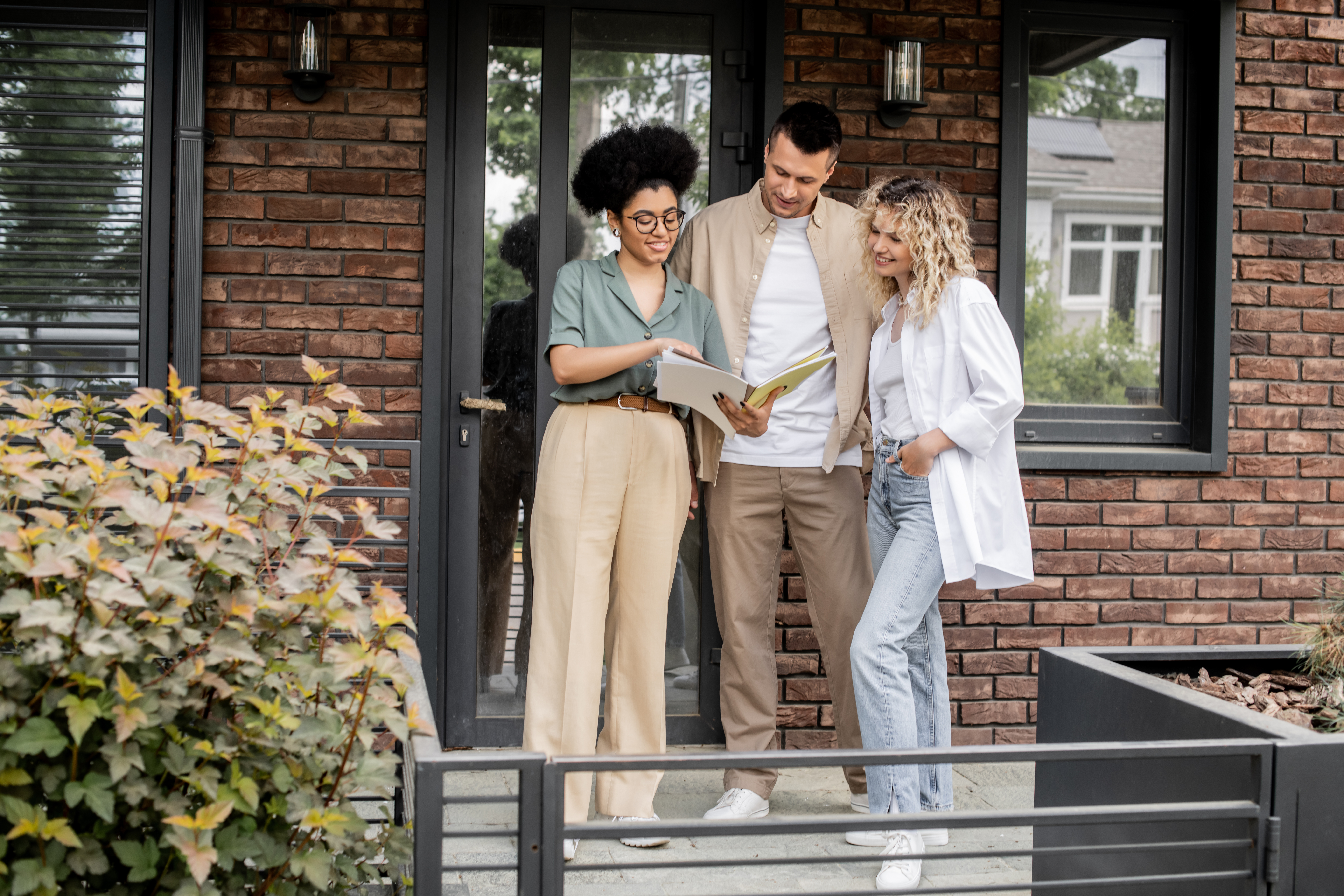 Estate agent discussing property details with a couple during a home viewing in Southampton.