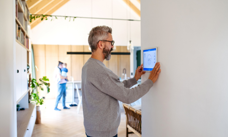 Landlord using a smart heating control in an energy-efficient rental property in Worcester.