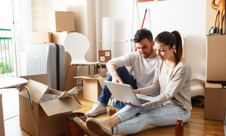 Young couple researching property investment opportunities from their home