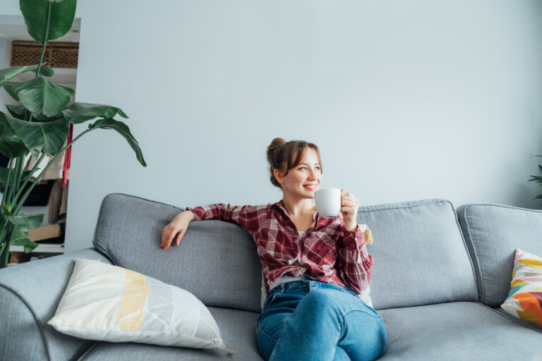 Woman relaxing in a comfortable home in Penkhull, Stoke-on-Trent.