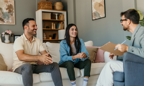Homeowners discussing their property sale with an estate agent in Solihull