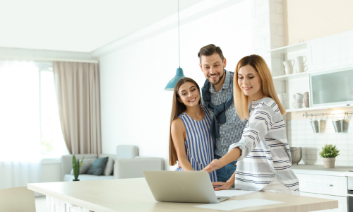 Tenants viewing property information on a laptop in a modern Leamington Spa home