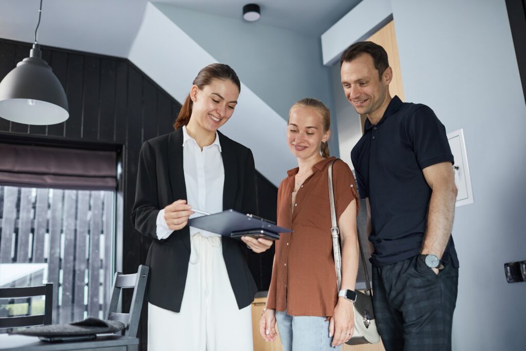 Letting agent meeting tenants at a family home in Cardiff