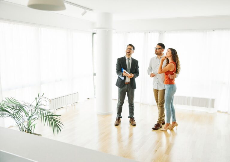 Estate agent showing buyers a home in Stoke-on-Trent